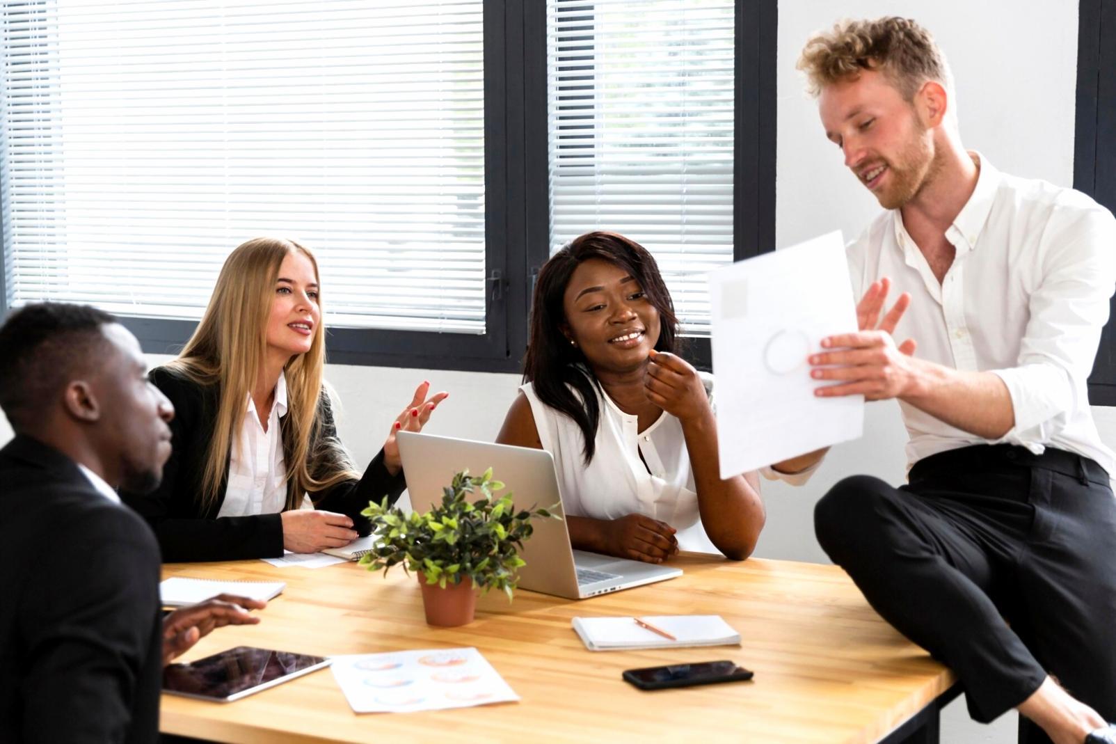 Professional reviewing financial analysis documents with charts and graphs